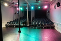 Studio with theatre lights viewed from stage